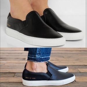 Woman by common project black leather slip on sneakers